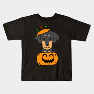 Funny dachshund is in a pumpkin Kids T-Shirt